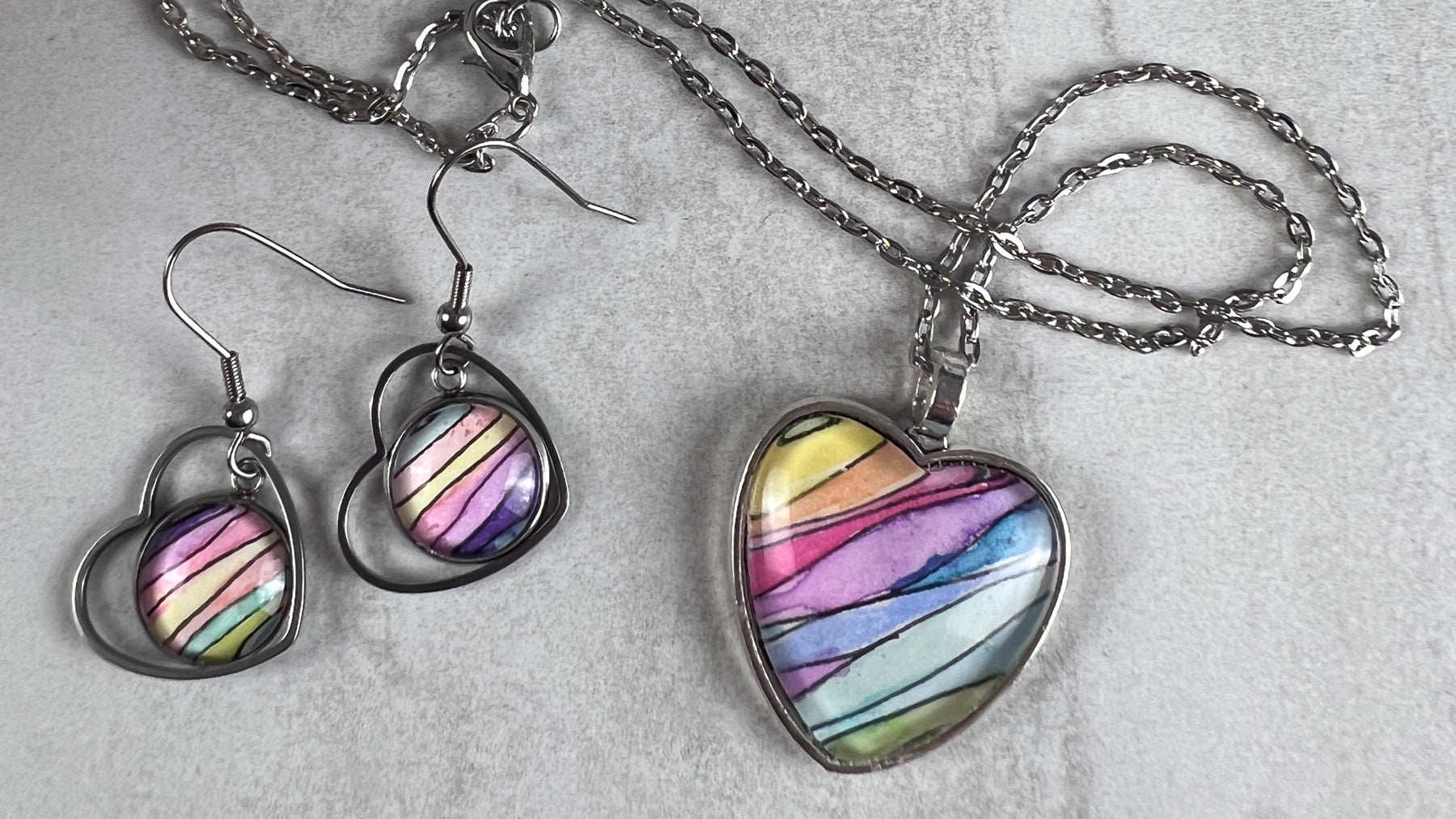 Rainbow Heart earrings and a Rainbow Heart Pendant. 
