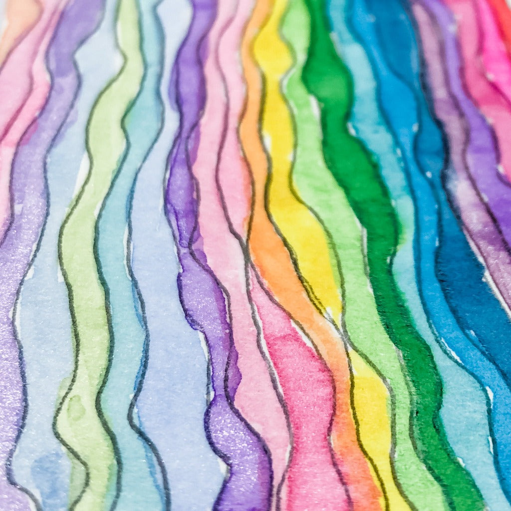 Closeup of the watercolor painting used to make the rainbow waves collection.