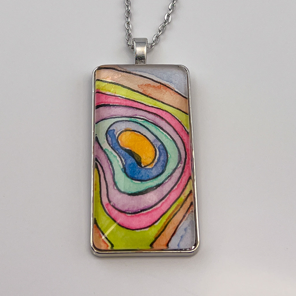 Hand-painted watercolor topographical map set behind a rectangular glass cabochon. 