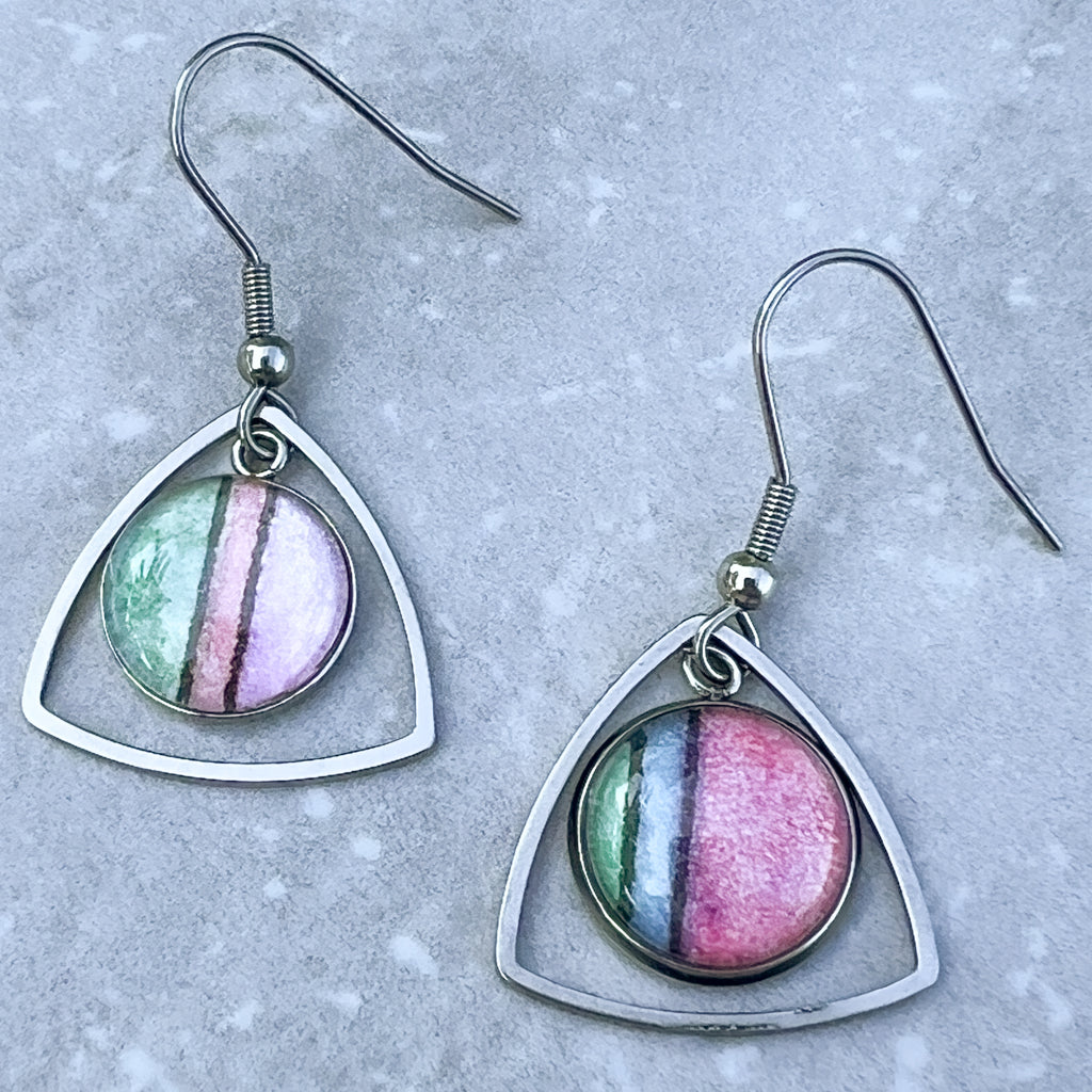 Pink, green, blue and purple pastel watercolor earrings with a triangular frame. 