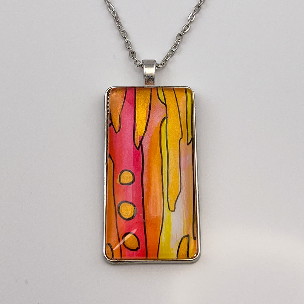 Wide rectangular watercolor pendant with a hand-painted watercolor design in hot pink, yellow and gold. 