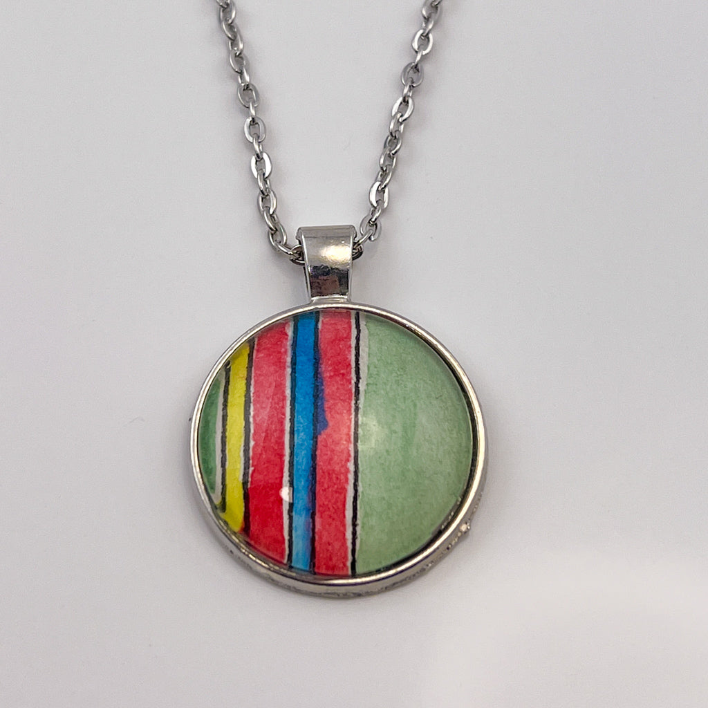 Huntleigh Round pendant on white background. 