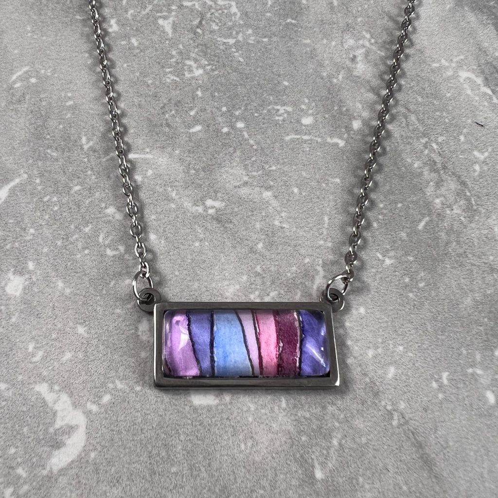 Horizontal rectangle necklace featuring wavy purple stripes in watercolor.