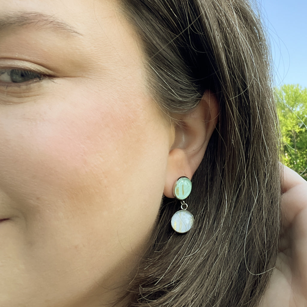 Phoebe double drop post earrings shown on model. 
