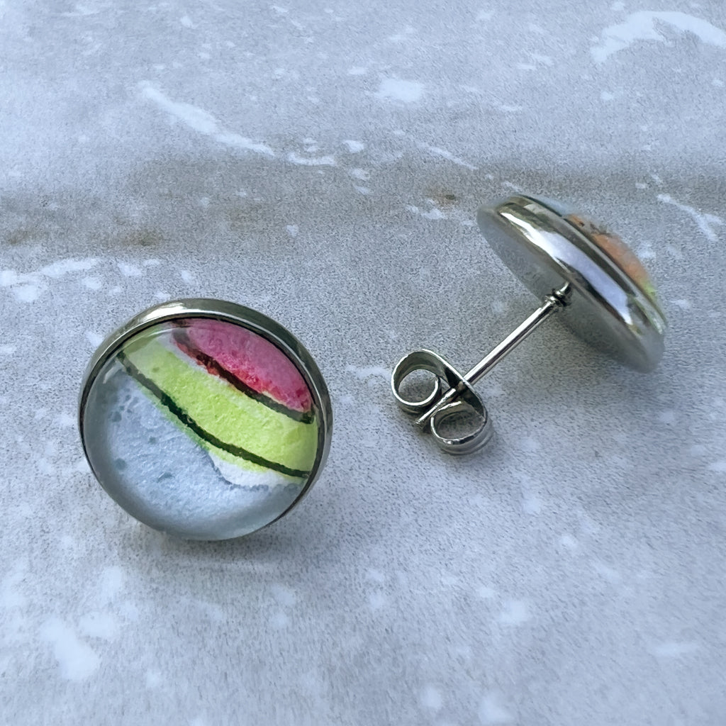Closeup of studs showing the post back of an earring. 