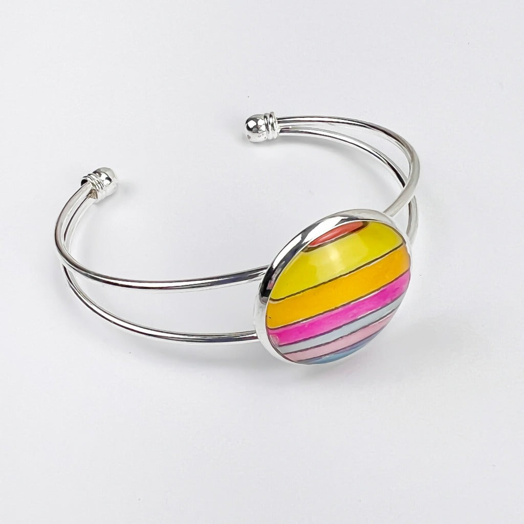 Summer Sun cuff bracelet shown on white background. 