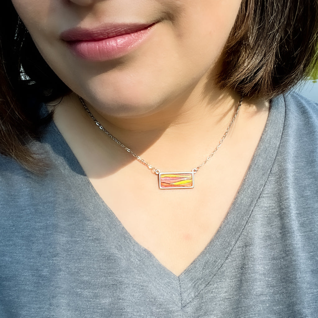 Sunset horizontal necklace shown on model. 