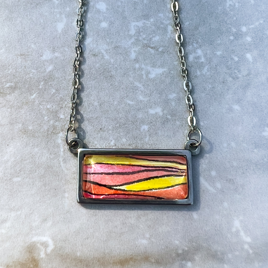 Sunset horizontal necklace close-up image. 