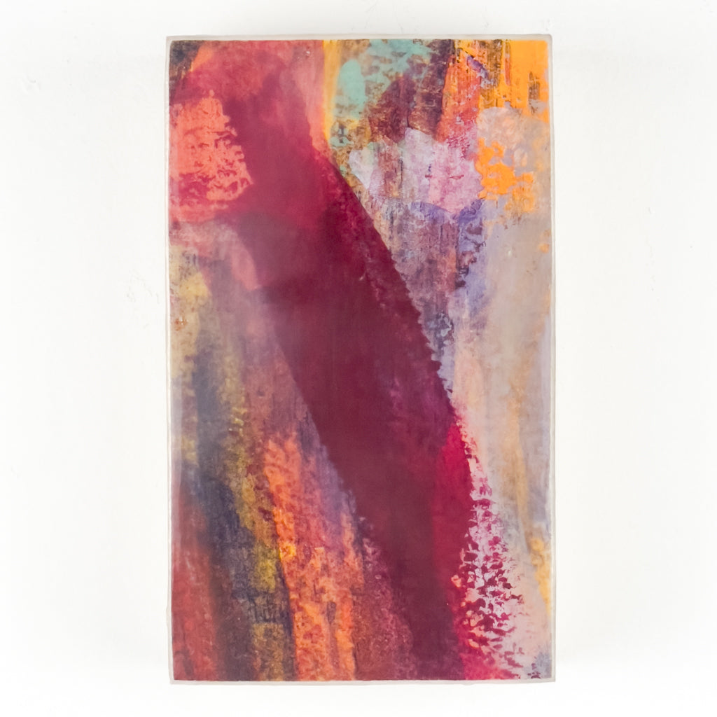 Front view of watercolor and encaustic painting, featuring layered shades of red and orange. 