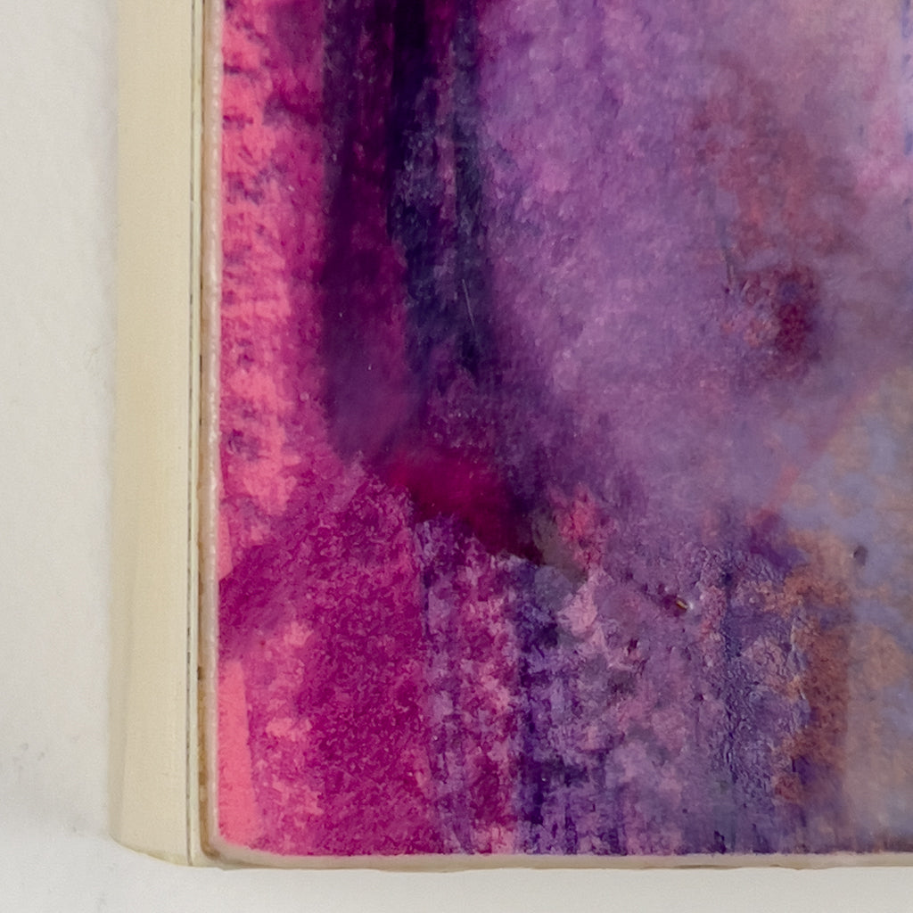 Front view of watercolor and encaustic painting, featuring layered shades of  pinks, purples and orange. 