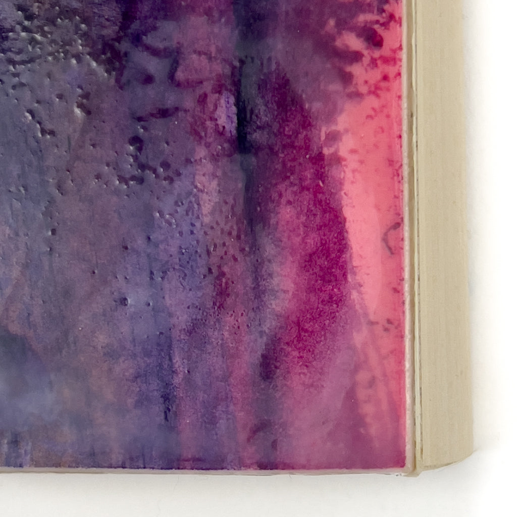 Front view of watercolor and encaustic painting, featuring layered shades of  pinks, purples and orange. 