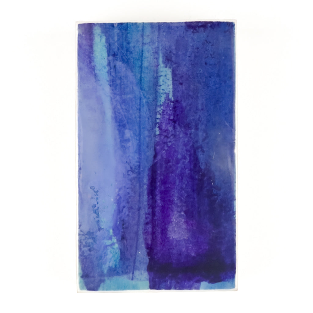 Front view of watercolor and encaustic painting, featuring layered shades of blue and purple. 