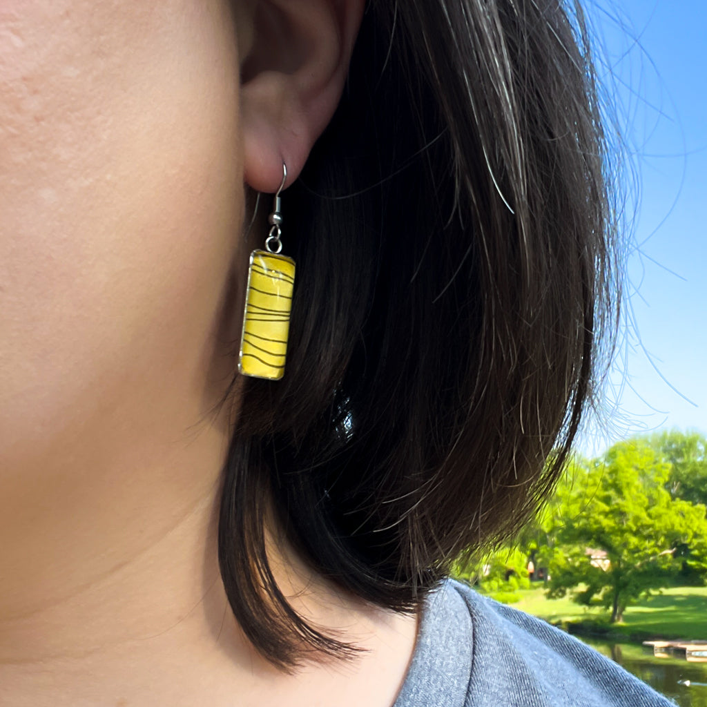 Tiger Stripe rectangular Vertical Drop earrings on grey background. 