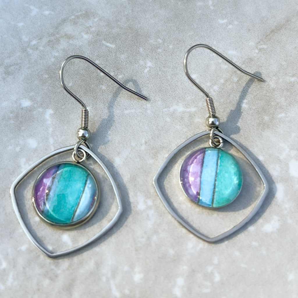 Hand-painted watercolor earrings in teal, purple and blue. 